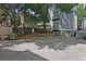 A backyard with gravel, garden bed with low retaining wall, and privacy fence at 15 Corinne St # B, Charleston, SC 29403