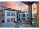 Outdoor living on the balcony provides scenic views of nearby neighborhood homes at 15 Corinne St # B, Charleston, SC 29403