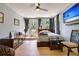 Cozy bedroom with TV, furniture, and access to a small outdoor patio at 15 Corinne St # B, Charleston, SC 29403