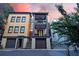 Three-story home with private garages, multiple balconies, and stylish architectural details at 15 Corinne St # B, Charleston, SC 29403