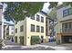 View of the rear exterior featuring an attached garage and balconies on the second and third floors at 15 Corinne St # B, Charleston, SC 29403