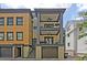 The home's exterior shows multiple balconies, a private garage, and a staircase leading to the main entrance at 15 Corinne St # B, Charleston, SC 29403