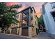 View of the home, displaying its modern exterior with balconies, private garage, and landscaped surroundings at 15 Corinne St # B, Charleston, SC 29403
