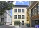 Rear exterior view showcasing a neutral color palette and well-maintained landscaping at 15 Corinne St # B, Charleston, SC 29403