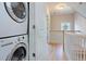 Bright hallway with stairs, coat closet and conveniently located washer and dryer at 15 Corinne St # B, Charleston, SC 29403