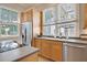 Charming kitchen featuring stainless steel appliances and natural light through large windows at 15 Corinne St # B, Charleston, SC 29403
