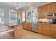 Well-equipped kitchen with stainless steel appliances, island with cooktop, and ample cabinet space at 15 Corinne St # B, Charleston, SC 29403