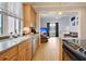 Open kitchen with stainless steel appliances, light wood cabinets and hardwood floors at 15 Corinne St # B, Charleston, SC 29403