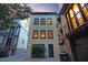Back exterior view of home featuring a dark back door and small yard at 15 Corinne St # B, Charleston, SC 29403