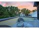Rooftop deck featuring comfortable wicker seating and a glass coffee table for relaxing outdoors at 15 Corinne St # B, Charleston, SC 29403