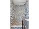 Bathroom features a shower with decorative gray tile and chrome fixtures at 15 Corinne St # B, Charleston, SC 29403