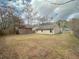 Spacious backyard with wooden fence and storage shed, perfect for outdoor activities and storage at 154 Tabby Creek Cir, Summerville, SC 29486