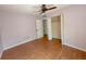 Comfortable bedroom boasts wood-look flooring, a ceiling fan, and a closet at 154 Tabby Creek Cir, Summerville, SC 29486