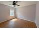 Cozy bedroom features wood-look flooring, a ceiling fan, and a bright window at 154 Tabby Creek Cir, Summerville, SC 29486