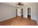 Spacious bedroom with wood-look flooring, a bathroom, and walk-in closet at 154 Tabby Creek Cir, Summerville, SC 29486
