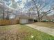 Charming single-story home with a front yard, driveway, and attached garage under a cloudy sky at 154 Tabby Creek Cir, Summerville, SC 29486