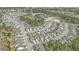 Aerial view showcasing a neighborhood with well-maintained homes and lush greenery at 1540 Dawn Mist Way, Charleston, SC 29414