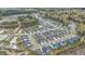 Expansive aerial view of a modern neighborhood with well-maintained homes, ponds, and lush green spaces bordering the community at 1540 Dawn Mist Way, Charleston, SC 29414