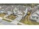 Aerial view of a two-story home with a manicured lawn and mature landscaping at 1540 Dawn Mist Way, Charleston, SC 29414