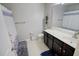 Cozy bathroom featuring a vanity with solid surface countertops, white walls, and a white and blue shower curtain at 1540 Dawn Mist Way, Charleston, SC 29414