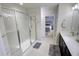 Bathroom with shower, vanity and view into the adjacent main bedroom at 1540 Dawn Mist Way, Charleston, SC 29414