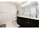 Neutral toned bathroom with tile floor, dark vanity, and tub/shower combo at 1540 Dawn Mist Way, Charleston, SC 29414