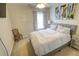 Cozy bedroom featuring a bed, a night stand, and a window at 1540 Dawn Mist Way, Charleston, SC 29414