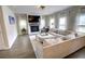 Cozy living room with a fireplace, TV and comfortable seating at 1540 Dawn Mist Way, Charleston, SC 29414