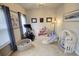 Bright playroom with natural light, neutral walls, carpet, and playful decor for children at 1540 Dawn Mist Way, Charleston, SC 29414