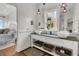 Chic bathroom features a double vanity with marble countertops, vessel sinks, and stylish fixtures at 1702 Palmetto Blvd, Edisto Island, SC 29438