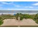 Direct beach access from the property with lush landscaping and a charming boardwalk at 1702 Palmetto Blvd, Edisto Island, SC 29438