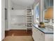 Bright room with a built in bunk bed, blue dresser and a window with blinds at 1702 Palmetto Blvd, Edisto Island, SC 29438