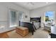 Comfortable bedroom with a dark wood bed frame and ample natural light at 1702 Palmetto Blvd, Edisto Island, SC 29438