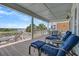 Relaxing covered deck featuring lounge chairs and ocean views, creating a serene outdoor living space at 1702 Palmetto Blvd, Edisto Island, SC 29438
