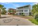 Charming beach house with manicured yard and direct beach access, perfect for coastal living at 1702 Palmetto Blvd, Edisto Island, SC 29438