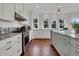 Bright, modern kitchen with stainless steel appliances and ample counter space at 1702 Palmetto Blvd, Edisto Island, SC 29438