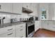 Close-up shot of modern kitchen with stainless steel appliances and ample counter space at 1702 Palmetto Blvd, Edisto Island, SC 29438