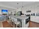 Modern kitchen boasts stainless steel appliances, ample counter space and barstool seating at the island at 1702 Palmetto Blvd, Edisto Island, SC 29438