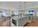 Spacious kitchen island with barstool seating and views of the Gathering room and water views at 1702 Palmetto Blvd, Edisto Island, SC 29438