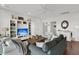 Bright living room featuring hardwood floors, comfortable seating, and large bookshelf at 1702 Palmetto Blvd, Edisto Island, SC 29438