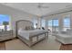 A bright and spacious main bedroom offers balcony access and neutral decor at 1702 Palmetto Blvd, Edisto Island, SC 29438
