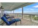 Relax on this ocean-view porch with comfortable seating to enjoy the coastal breeze and scenery at 1702 Palmetto Blvd, Edisto Island, SC 29438