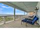 Expansive porch with comfortable seating offers ample space for relaxation with stunning ocean views at 1702 Palmetto Blvd, Edisto Island, SC 29438