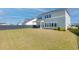 Expansive backyard with green lawn and covered patio, perfect for outdoor living at 181 Ashworth Dr, Summerville, SC 29486