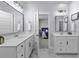 This bathroom has double vanities and a peek into a bedroom at 181 Ashworth Dr, Summerville, SC 29486