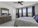 This bedroom has large windows, gray carpet and a decorative mirror at 181 Ashworth Dr, Summerville, SC 29486