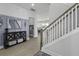 Elegant foyer with stylish console table, mirror, and staircase leading to the upper level with hardwood floors at 181 Ashworth Dr, Summerville, SC 29486