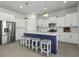 Modern kitchen with white cabinets, stainless steel appliances, and a large island with seating for casual dining at 181 Ashworth Dr, Summerville, SC 29486