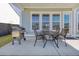 Covered patio with seating and grill, perfect for outdoor entertaining and dining at 181 Ashworth Dr, Summerville, SC 29486