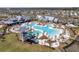 Aerial view of a large community pool with a slide and seating areas surrounded by palm trees at 181 Ashworth Dr, Summerville, SC 29486